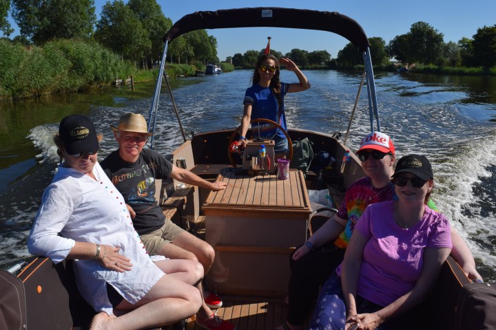 Five people on a boat